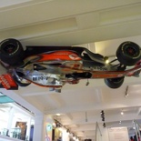 An inverted mclaren F1 at the entrance