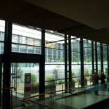 the museum has a mix of old and modern glassy architecture