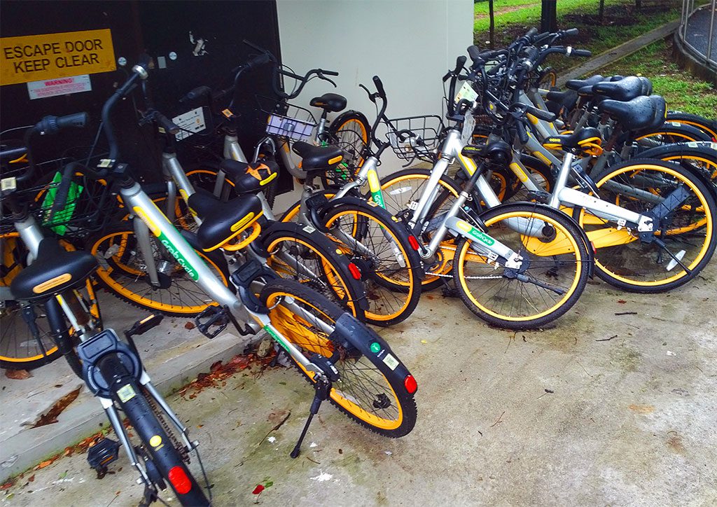 A mess of obikes in a neighborhood