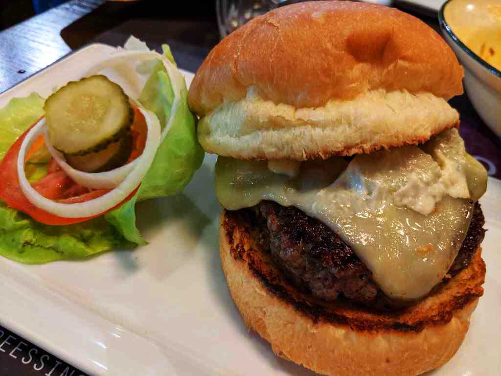 Their burgers are juicy topped with melted cheese between two toasted buns