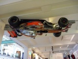 An inverted mclaren F1 at the entrance