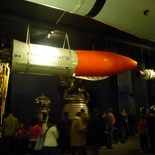 There are many rocket and satellites on display