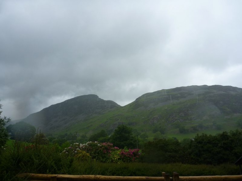 The cloud covered mountain peaks