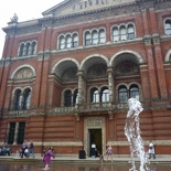 the hallway runs alongside the entrance to the museum courtyard