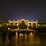 The railroad station lit at night