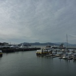 a clear day with the golden gate bridge in the far left