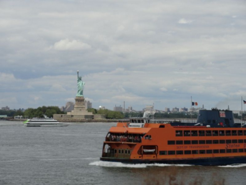 The ferry runs right pass the statue