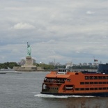 The ferry runs right pass the statue