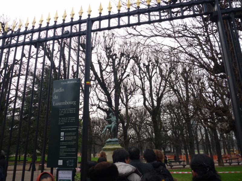 Behind the wrought iron grill and gates...