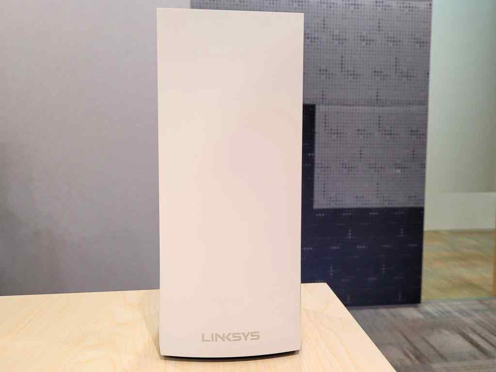 The Linksys MX4200 Mesh Router in the flesh. It is a sleek white router covered in matte plastic which won’t look out of place in your modern living room