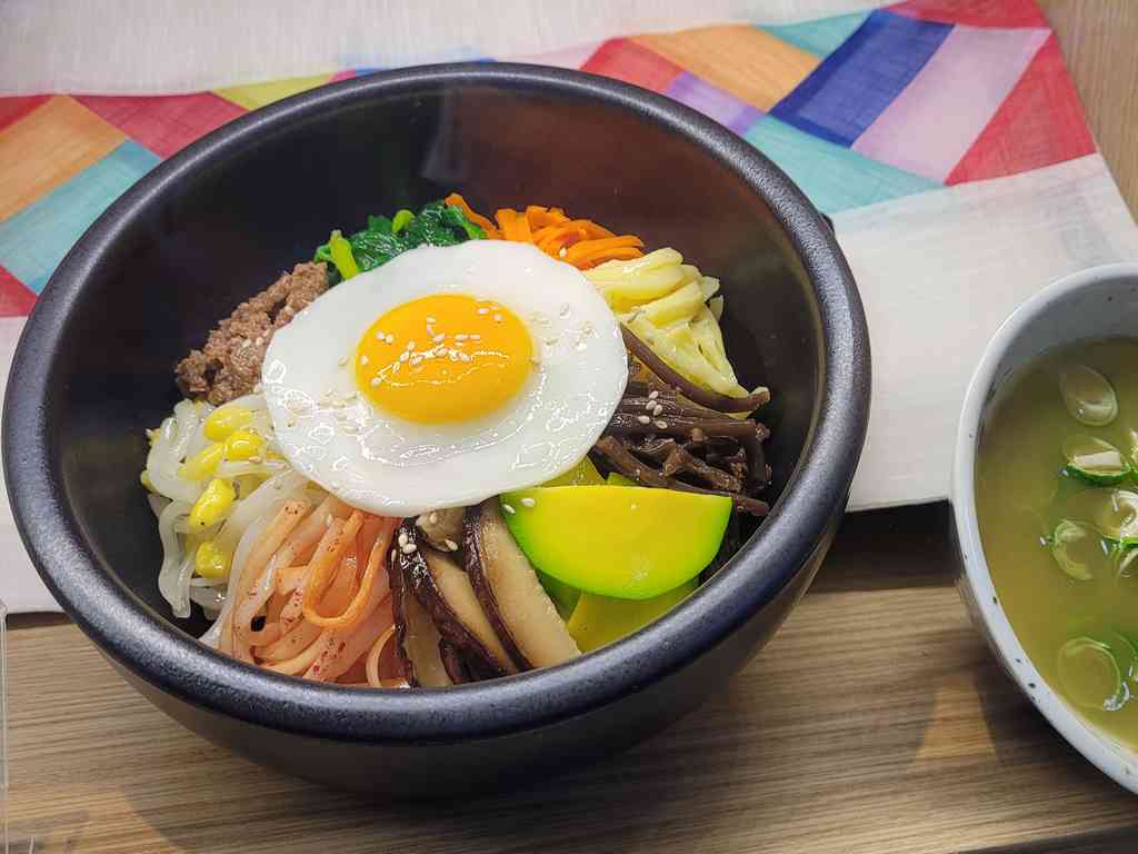 Bibimbap, a rice staple served in a hot stone bowl